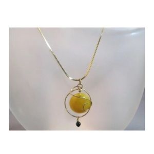 Round butter amber gold tone metal necklace pendant